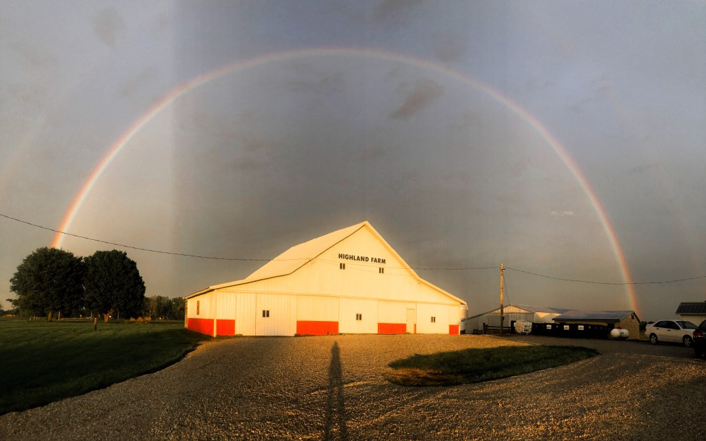 Our barn underneath a curtain of rain and a rainbow